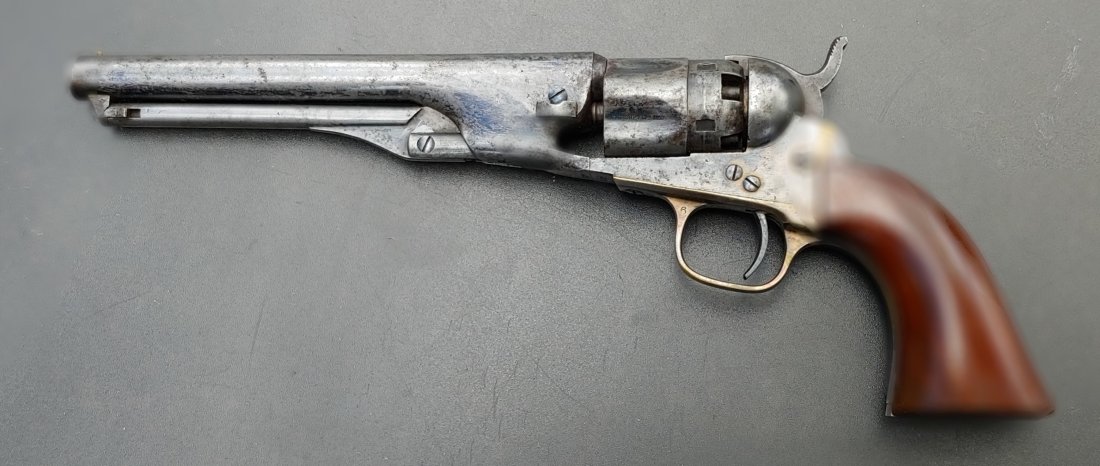 Model 1862 long barrel Colt police revolver: A good solid example of the 1862 Colt Police Model Revolver as carried by thousands of officers in the Civil War. Has all matched war date serial numbers of 12,137. No finish. Sharp markings. Mechanic