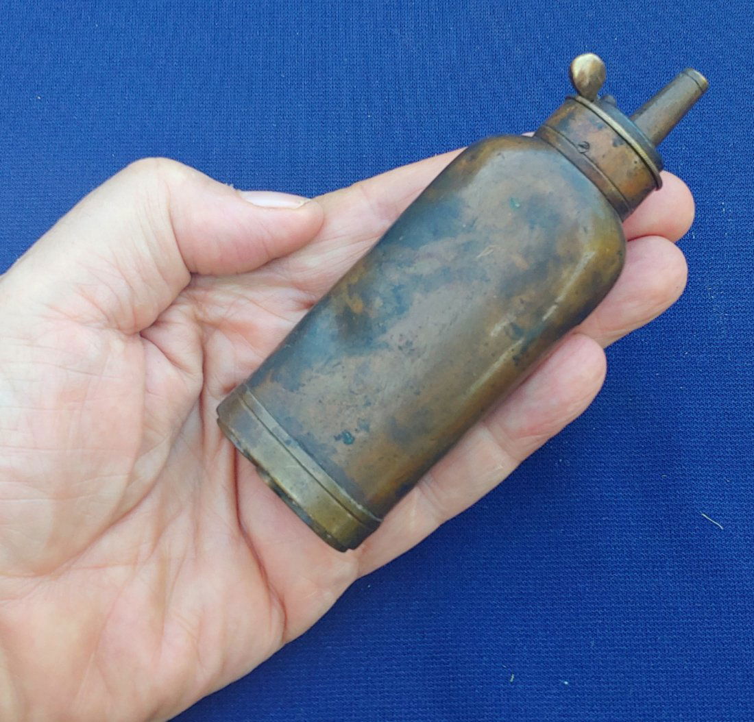 Antique 1840s copper powder flask with compartments: Quality 1840 era powder flask with two compartments in the bottom for caps and balls. Rich undisturbed patina. Works perfectly. Quite heavy. $25 for packing and UPS shipping. Insurance is $1.50 per $1