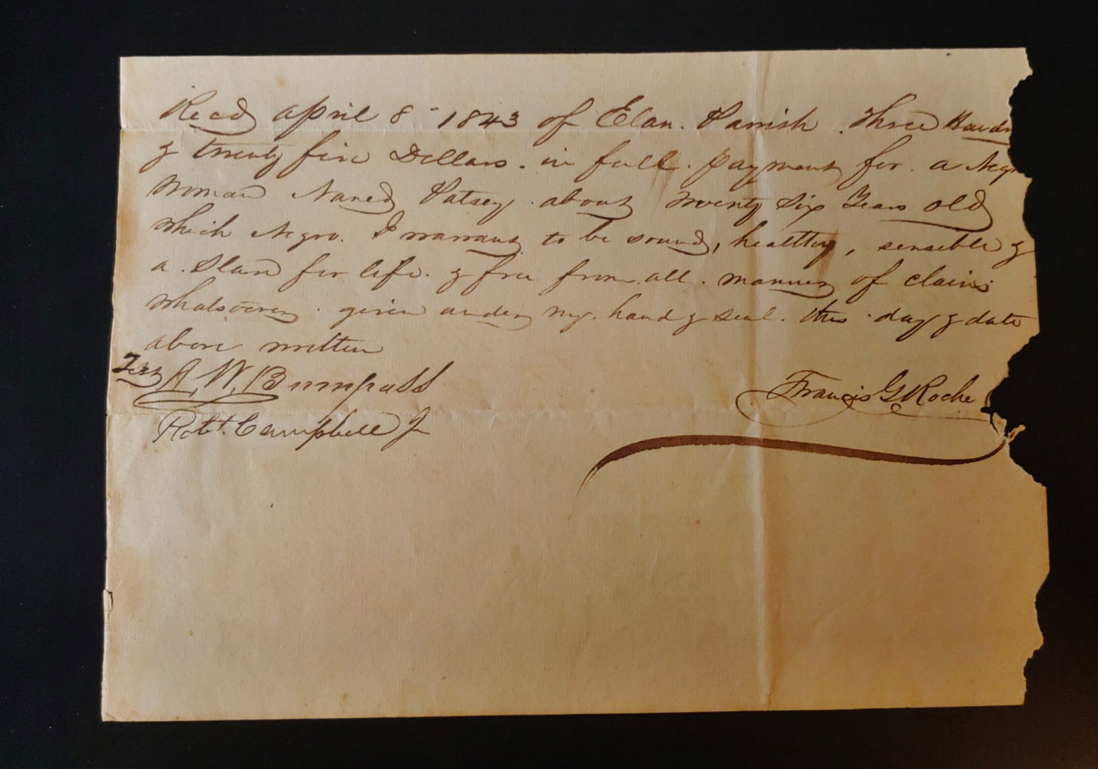 Manuscript ink receipt for the sale of a slave woman named Patsy: Dated April 8th 1843 regarding the sale of a 26-year-old slave woman named Patsy for the sum of 325. Contains all the legalese about her being a slave for life and free from encumbrances and being hea
