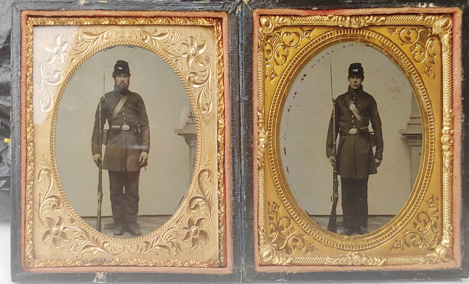 Matched pair Sixth Plate Armed Civil War Tintypes.: Likely family members though they don't bear much resemblance. Obviously taken together on the same day, they are identically armed and posed except one guy forgot to switch his cartridge box strap di