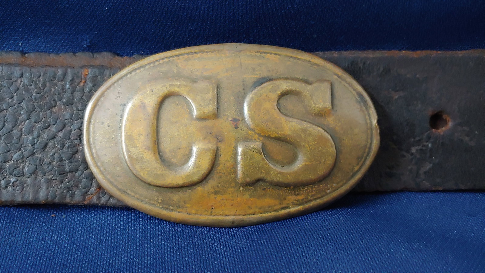 CS Oval Buckle on Belt: A top of the line Rope-Border CS oval still on the original leather. These are VERY hard to find in non-dug condition. All three hooks firmly in place. No repairs. No damage. $35 for materials, packin