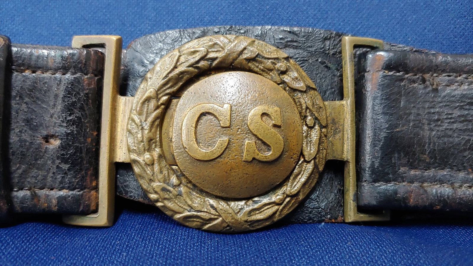 Civil War Confederate Officer's Belt & CS Interlocking Buckle: Beautiful and of the highest quality. Original officer's belt sometimes referred to as an artillery model with a large brass ring. No saber straps remain. The tongue and wreath CS plate is beyond supe
