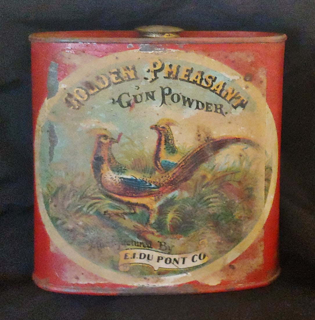 Beautiful antique Golden Pheasant Gun Powder Tin GREAT LABEL: Beautiful 100+ years old Golden Pheasant Powder can red with an attractive color label showing two pheasants. 4" x 5½" x 1½", with the original brass screw cap. DuPont. $20 for materials
