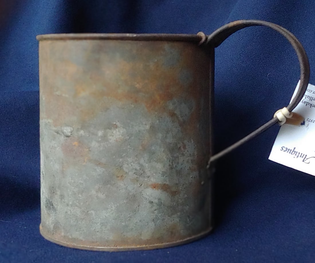 Civil War Union Army regulation issue drinking cup: Regulation 1860s US Army issue tin cup. Heavy tin and holds a quart. These also doubled as a coffee boiler and are sometimes found with wire bails attached. The heavy reinforcement wires securing the 