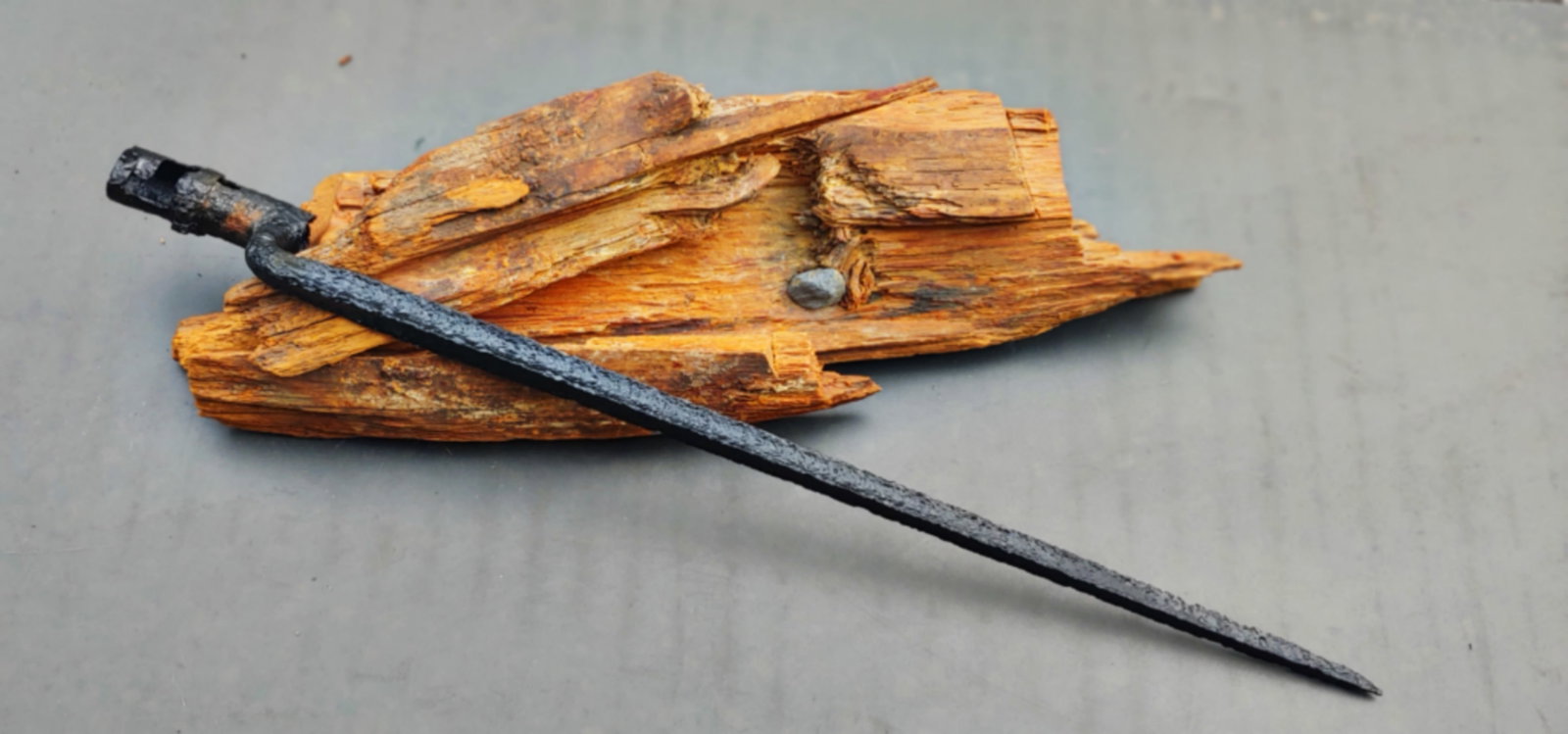 Huge mini ball in Wood Relic: A big old hunk of log or fence rail that is broken into three pieces which exposed a mini ball, musket ball embedded . The bayonet is shown for size reference . $35 for packing UPS shipping and signat