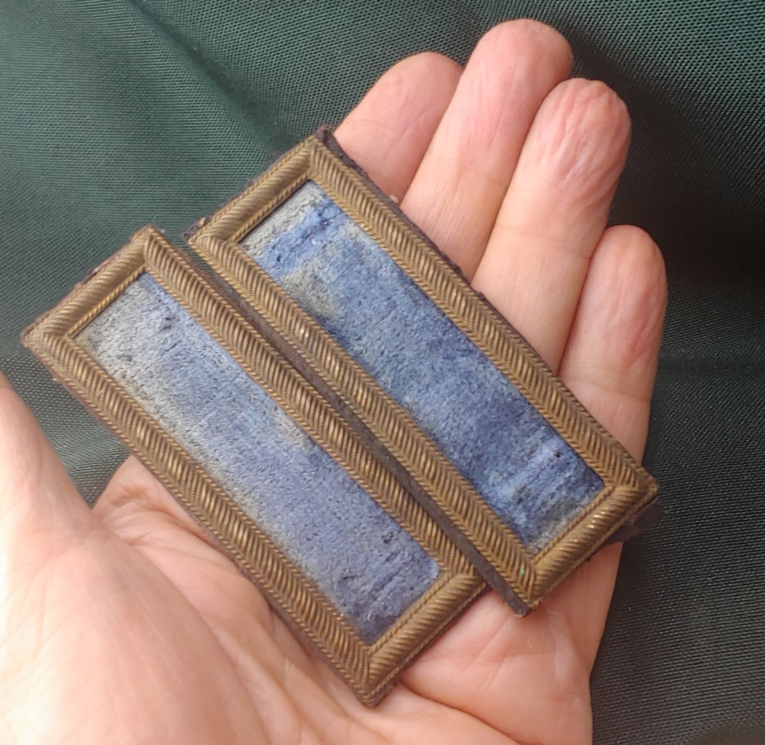 Civil War infantry Lieutenant shoulder straps. Demoted?: Civil War Smith style shoulder straps with stamped brass false embroidered bullion edge borders and attractive rich sky blue cloth centers. These tell a story. They once clearly had single rank bars o