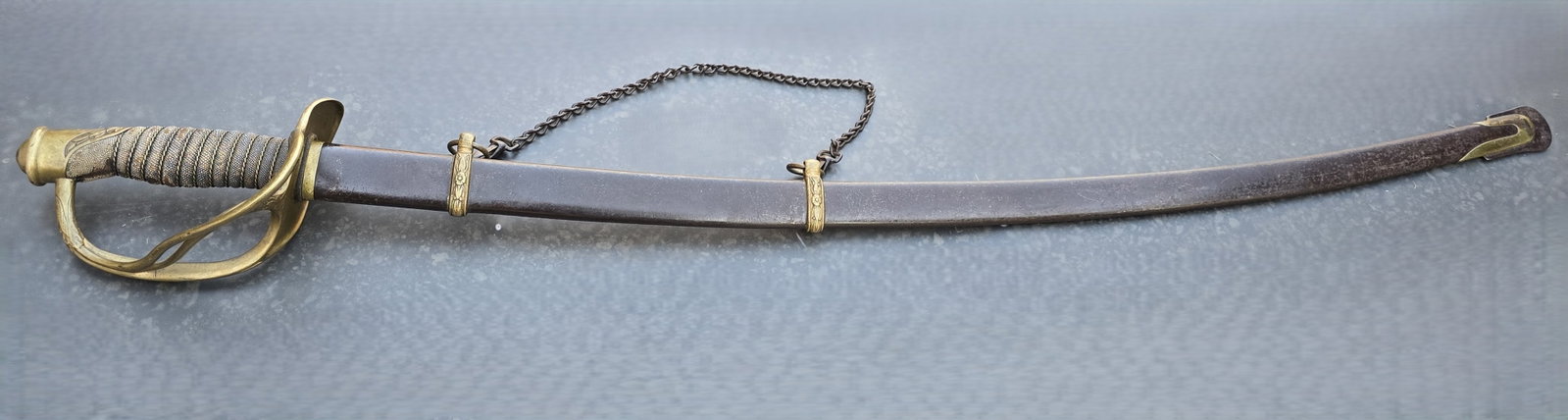 Extremely Scarce M1860 Ames Cavalry Officer's Saber in Brass Mtd Scabbard: An incredibly scarce Ames mounted officer's saber that is among the most elusive Civil War swords to obtain. 99% of all collectors will never find one. And most collectors will never get to see one in