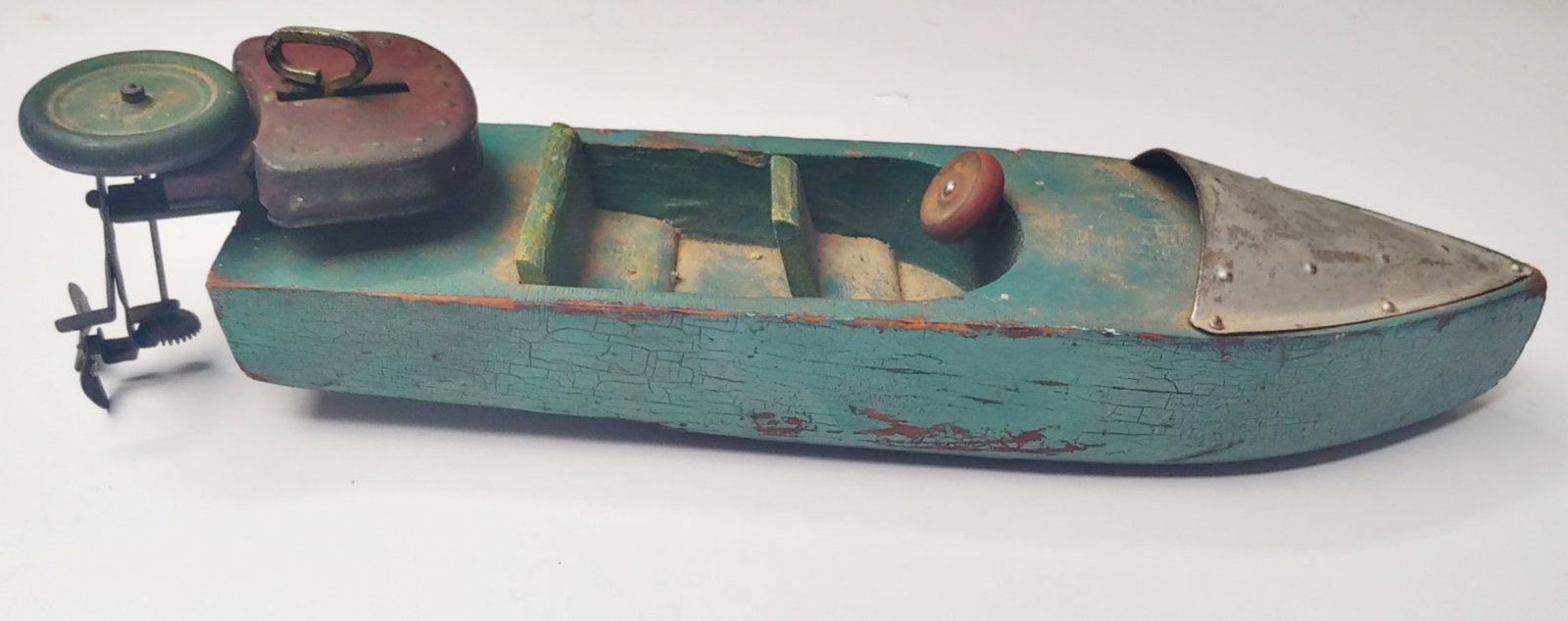 Really cool 1920s large size functioning wind up toy motorboat: Nearly 14 in Long and works perfectly . I have no idea who made it because it doesn't have any markings I have always had an affinity for old time kids toys especially mechanical ones . This is really