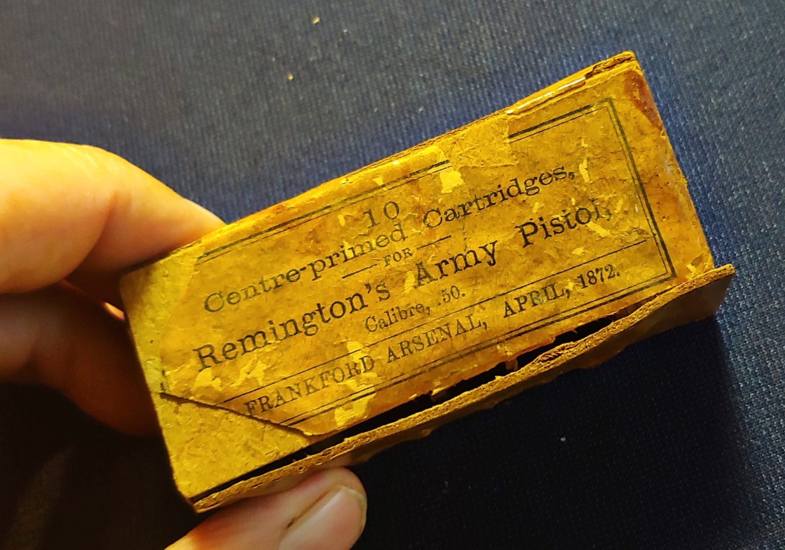 Box and label 1872 44 caliber Remington Army revolver ammunition: An empty box for 44 caliber metallic cartridges for the Remington Army revolver . Dated 1872 this is about as early as you can get . One end of the empty box is missing as shown . $20 for packing UPS 