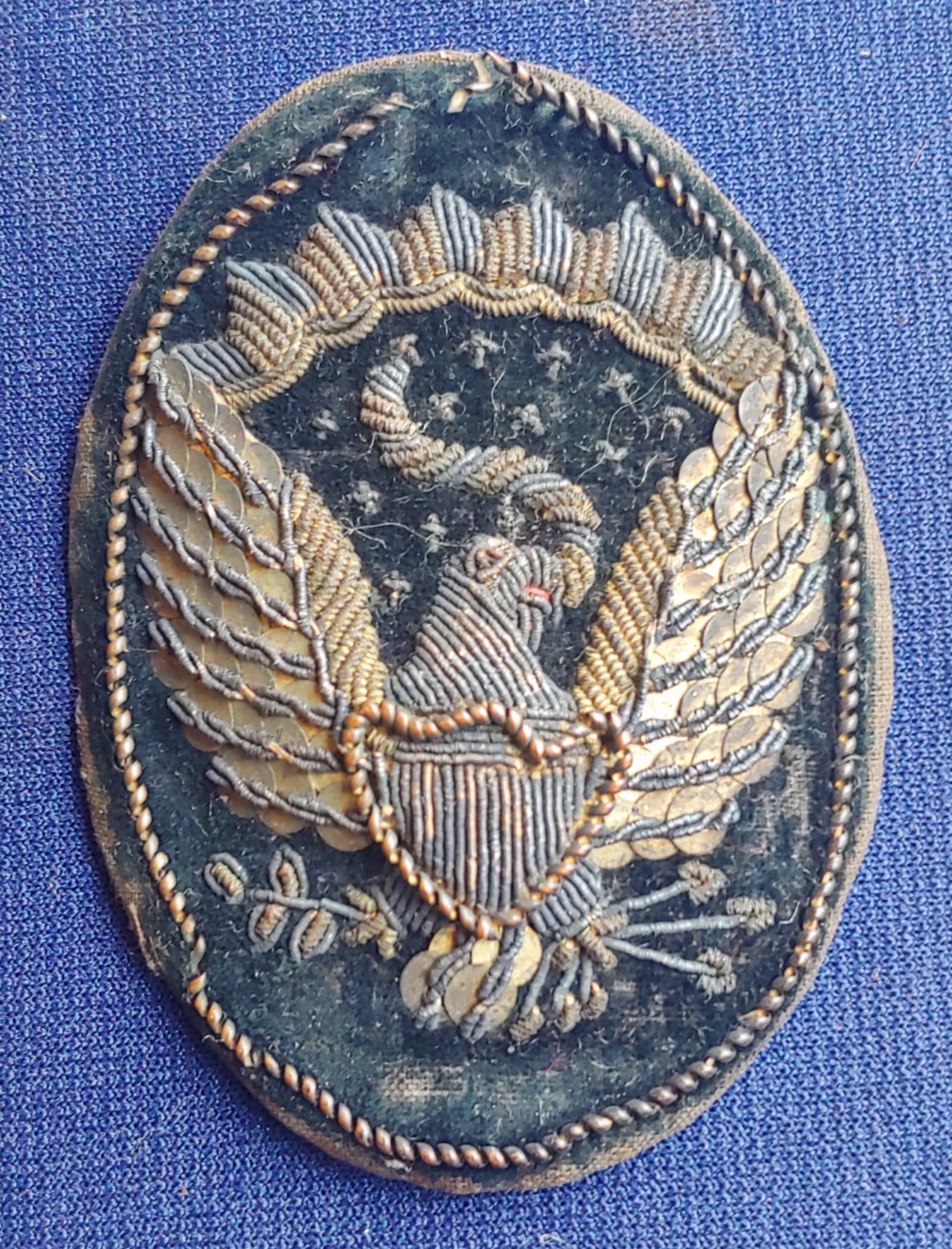 Civil War officers bullion embroidered Eagle hat insignia: This is the piece of insignia worn by Civil War officers on the side of their black slouch hats and Hardee hats to pin the side Brim upright to the body of the Hat. These have always been pretty scarc