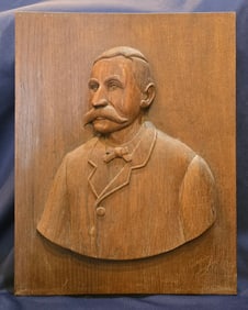 Big mustache relief carved portrait Western man
