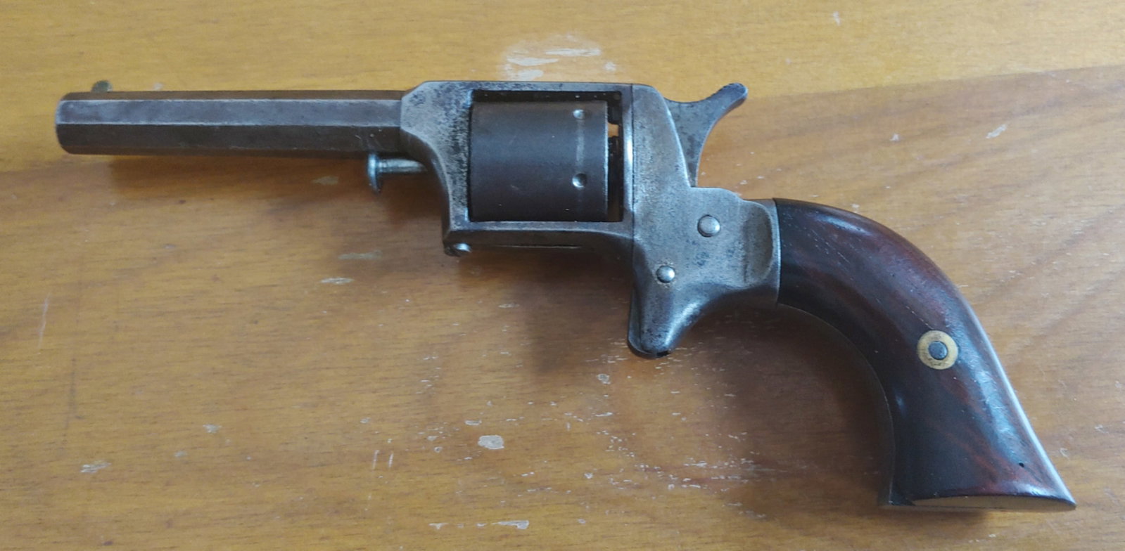 Civil War w. L. Grant 22 caliber revolver: Solid and handsome little cartridge revolver made by the Uhlinger company, and marked W.L Grant on the top Barrel flat. Three digit serial number on the butt strap. Assembly number on the bottom of th
