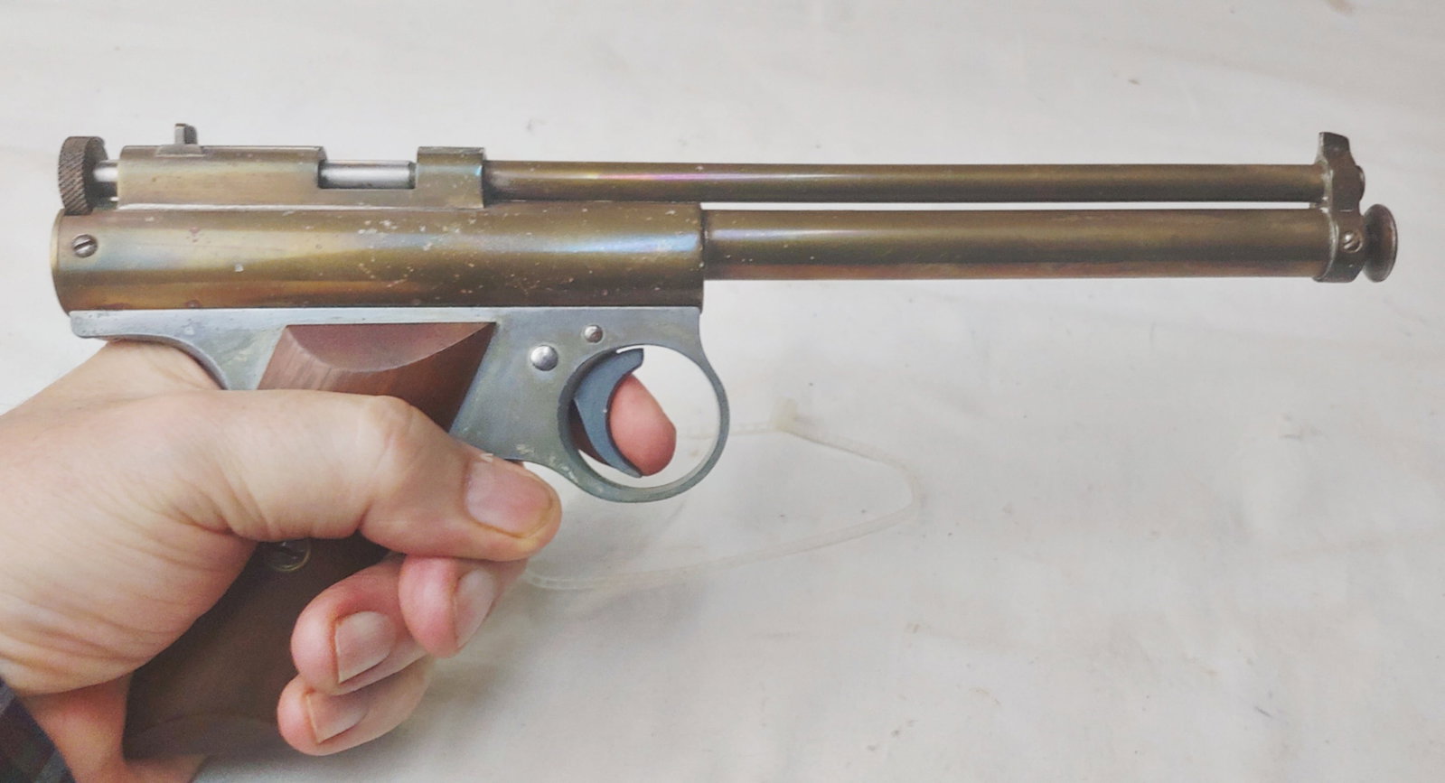High quality Precision manufactured Benjamin air pistol Rifled: A very handsome and well made 177 caliber single shot precision air pistol made by Benjamin in St Louis. It has a seven and a half inch rifled barrel in brass. To cock it you withdraw the plunger from