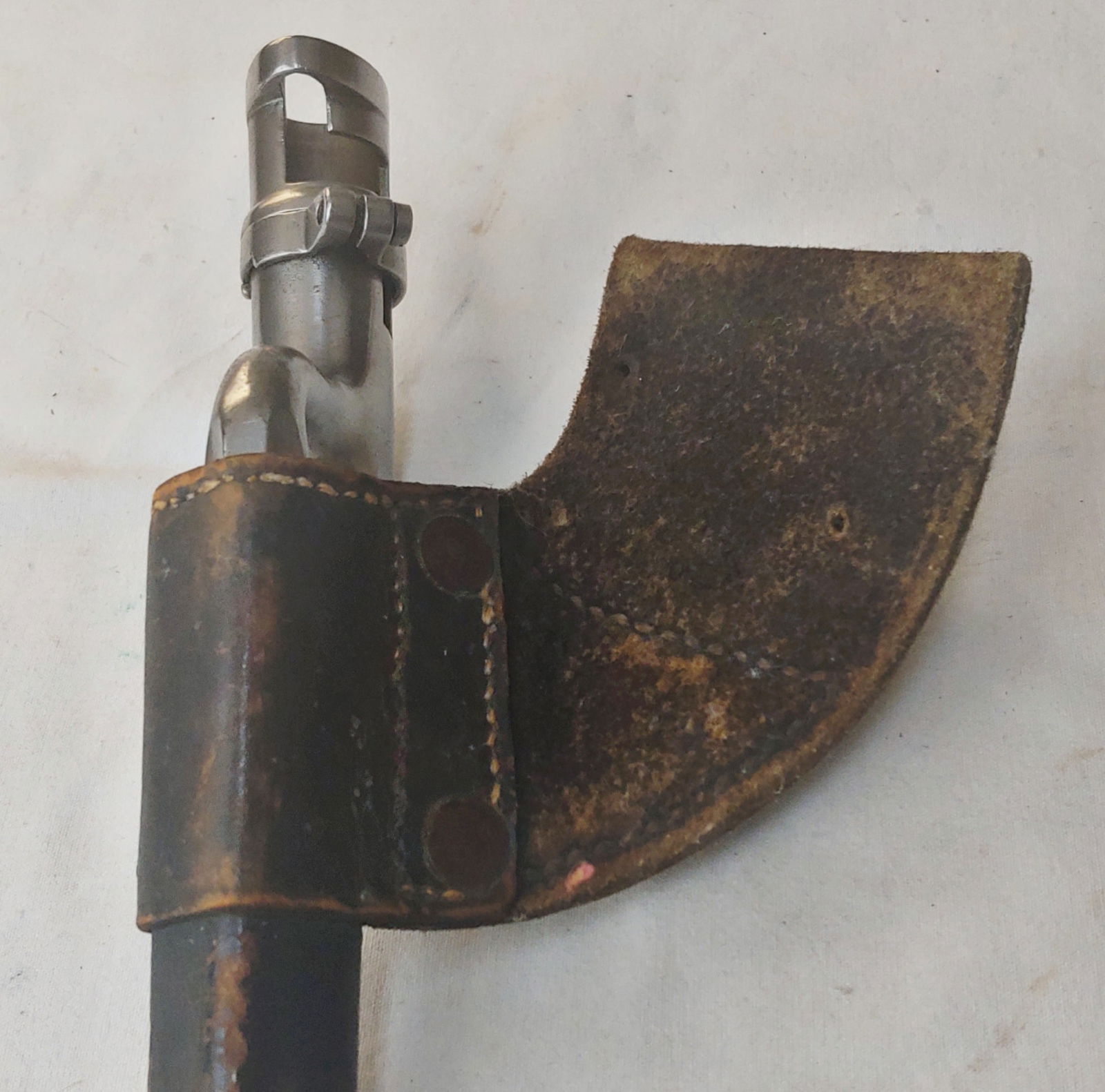 Very early Civil War bayonet and Scabbard fine condition: A top drawer example of the Union Soldiers 58 caliber socket bayonet for the 1855, 1861, and 1863 model springfields. This has the early Scabbard with two copper rivets and triangular stitching. It li