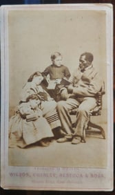 CDV photo of Wilson chin the Branded slave reading to slave children.