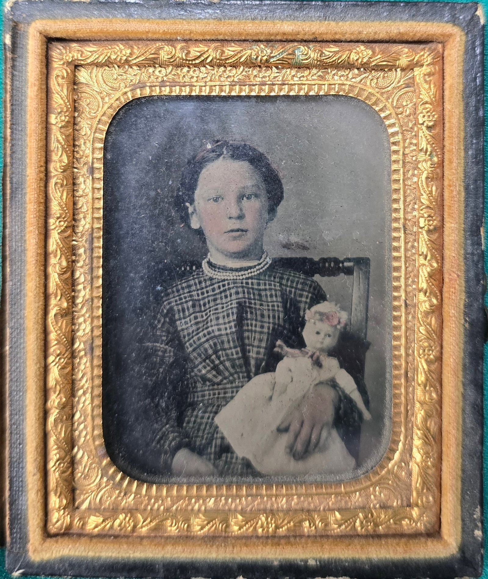 Early 1860s tintype little girl with doll in full case: If you are looking for a personal item to display with what a soldier would have been carrying in his knapsack this is just the ticket. 9th plate tintype in full case, hinge separated. Very handsome p