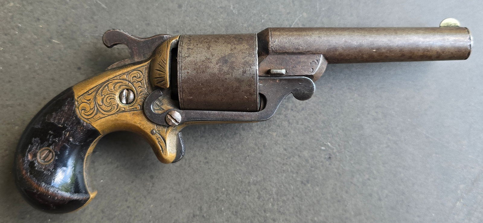 Moore Teat Fire Revolver: Moore front loading revolver with a 3.25-inch barrel and six shot cylinder. These weapons were produced from 1864-1870.Barrel marking of National Arms Co BROOKLYN, N.Y. Cylinder indexes properly and i