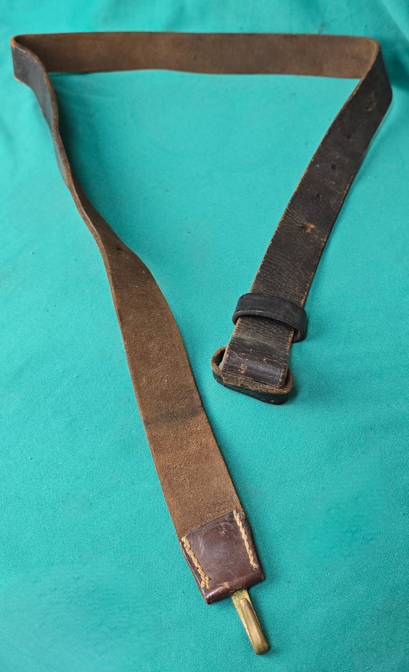 Shoulder Support Strap For CW Cavalry Saber Belt: Solid example of the leather over-the-shoulder strap for the CW enlisted cavalry saber belt. Harness leather. $15 for packing, shipping, and signature service. Insurance is $2 per hundred dollars in v