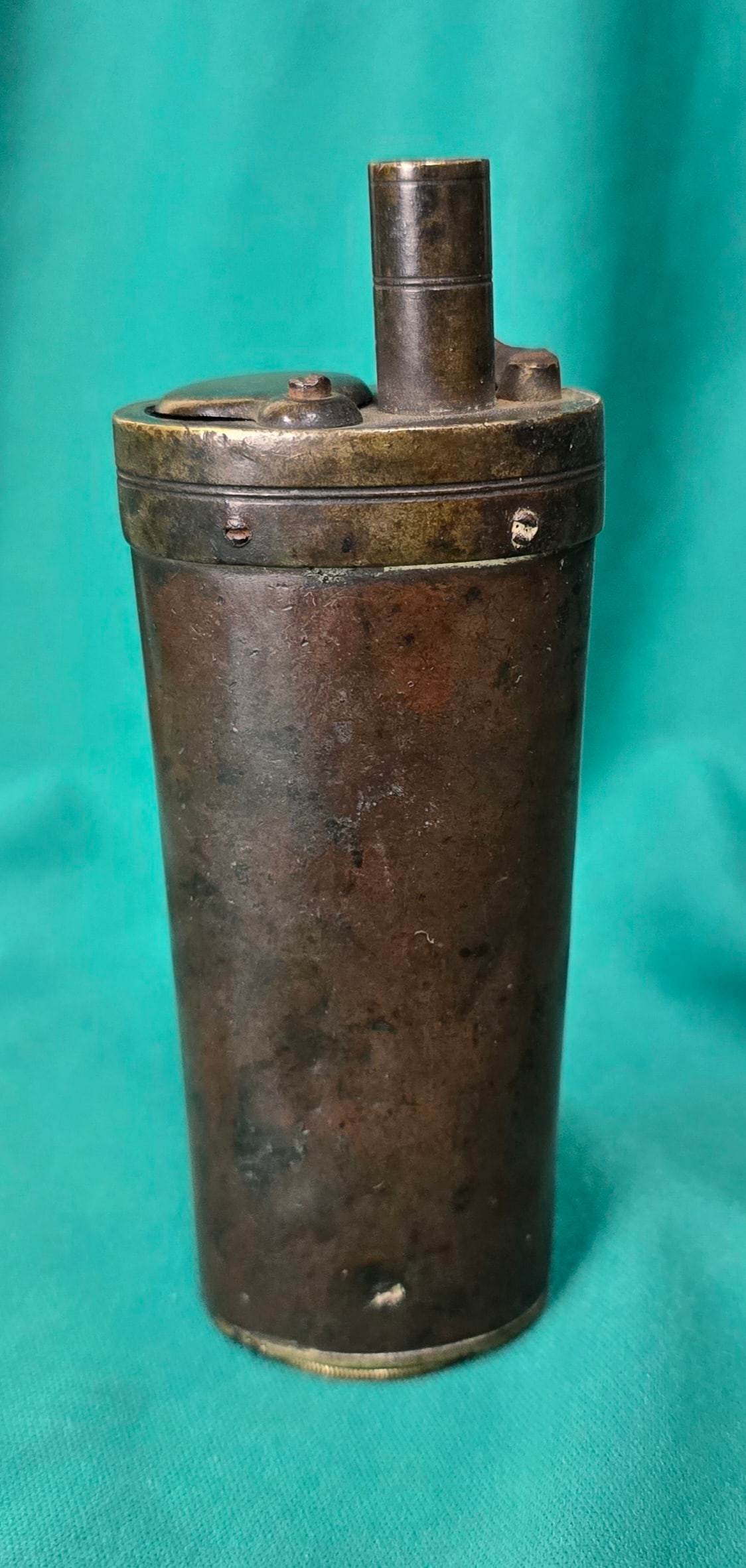 Early Copper and Brass One Compartment Powder Flask: Quite early. 1840s. Oval-cylindrical body has some dents and a nice deep patina. Large compartment in the bottom. $20 for packing, shipping, and signature service. Insurance is $2 per hundred dollars