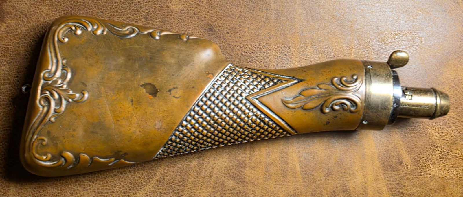 1860 Powder Flask / Scarce Buttstock pattern: American Flask and Cap Company powder flask in very good to fine condition. These flasks shaped like a shotgun or rifle buttstock are quite scarce and have always been highly sought by flask collector