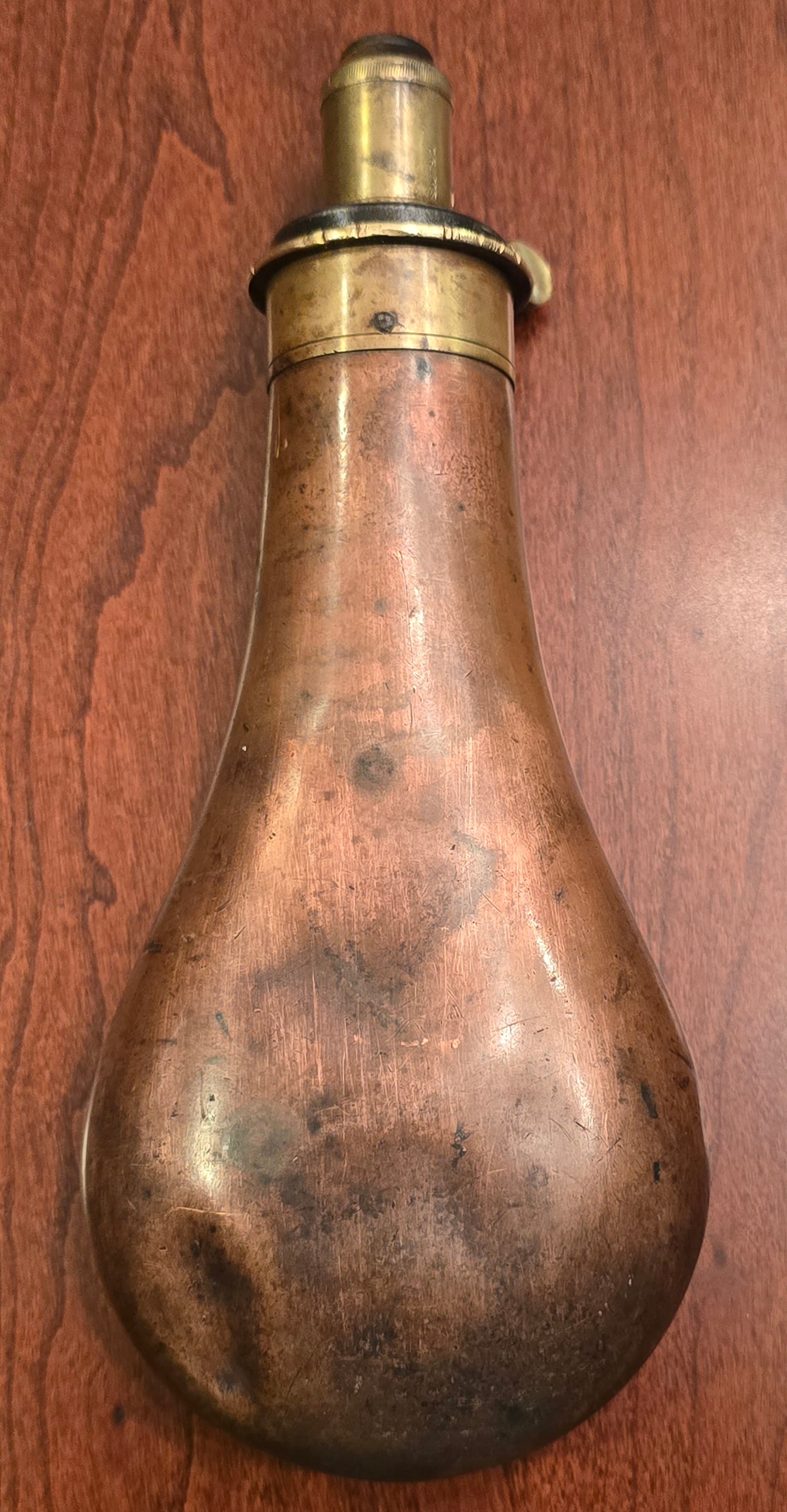 Powder Flask: 8" x 3.5" Good condition. Functions well. $20 for packing and UPS shipping with signature required service. Insurance is $2 per $100 in value. No shipments outside the USA.