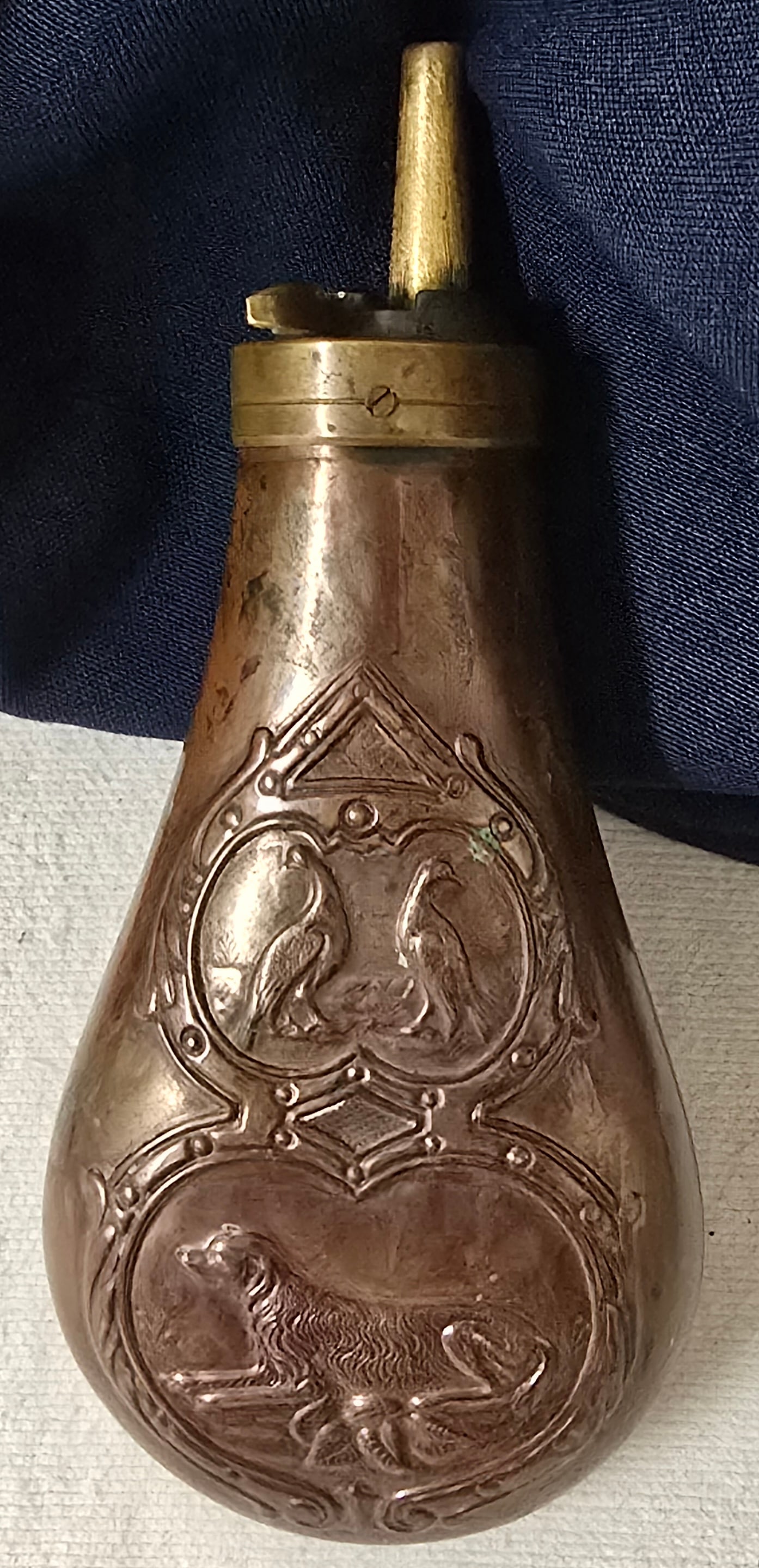 Hunting Dog Flask: A real handsome civilian powder flask Circa 1860. Real nice condition. About 5 in tall not including the spout. $20 for packing and UPS shipping with signature required service. Insurance is $2 per $1