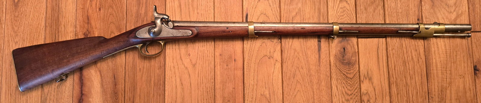 European Cadet Size Percussion Musket.: NEEDS DIMENSIONS Brass mounted arsenal made percussion musket, being a miniature version of a full size 72 caliber musket. Good condition but has some repair and filler on the counter pane of the stoc