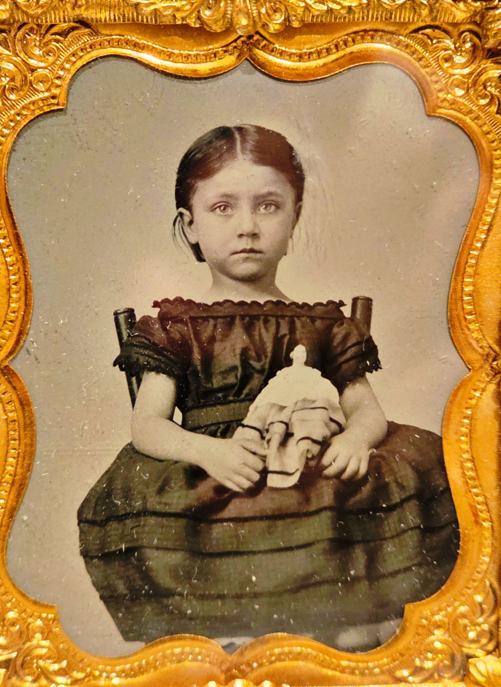 9th plate tintype little girl with her doll: Exquisite, seated portrait of a very pretty little girl dressed up in her best dress and holding her favorite doll. Excellent Clarity contrast and condition. Housed in a half case. $20 for packing and