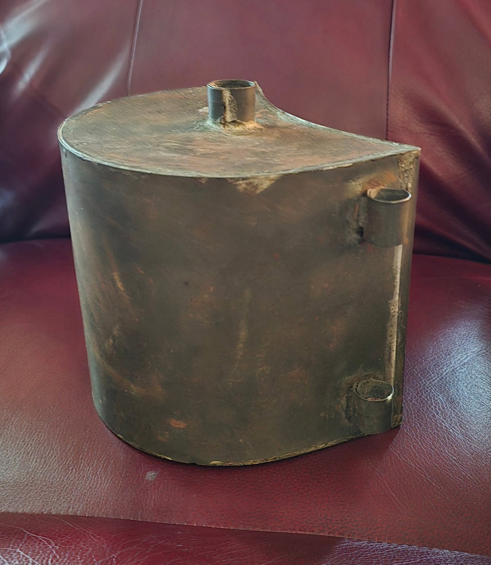 Colonial Crescent Canteen Fort Ligonier Style: This crescent, kidney-shaped, tin canteen measures approximately 7 inches tall by 8 inches wide and features a contoured crescent profile designed to rest flush against the body. Constructed from