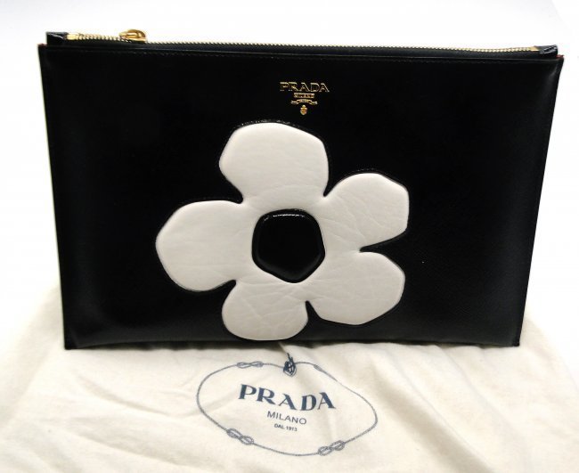 PRADA iPad & Carry All Clutch(Limited Edition)Bag $975: Prada iPad & Carry All Clutch with Side Handle-LIMITED EDITION100% Authentic-Made in Italy-Black patent leatherColor: Black/WhiteSize Approx: 12 x 8 inches-Condition Very Good (looks almost new)Comes