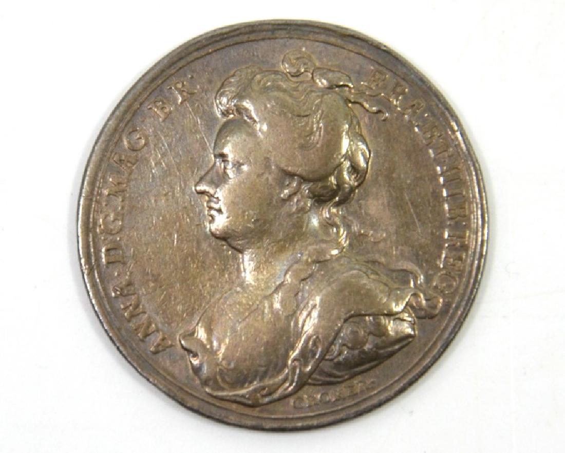 British Medals, Anne, the Battle of Blenheim, silver: British Medals, Anne, Battle of Blenheim, silver medal 1704, by J. Croker, draped bust l., legend 'ANNA. D:G. MAG. BR. FR. ET. HIB:REG.', rev. Britannia seated on globe holds Victory in hand, captive
