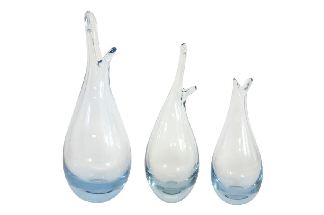 Per Lutken for Holmegaard, a graduated set of three: Per Lutken for Holmegaard, a graduated set of three blue glass beak vases, circa 1955, incised marks and numbers 14405, tallest, 24.5cm high (3)