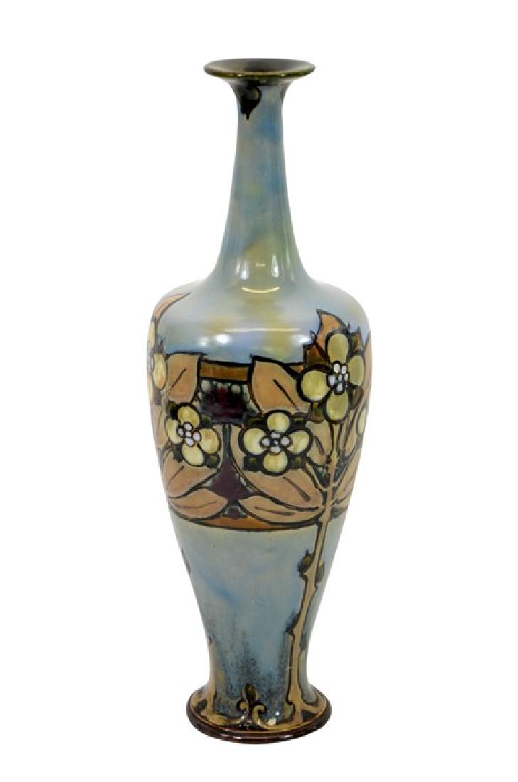 Francis Pope for Doulton Lambeth, a stoneware vase,: Francis Pope for Doulton Lambeth, a stoneware vase, elongated shouldered form with narrow neck, blue with stylised flowering trees, incised marks, 38cm high
