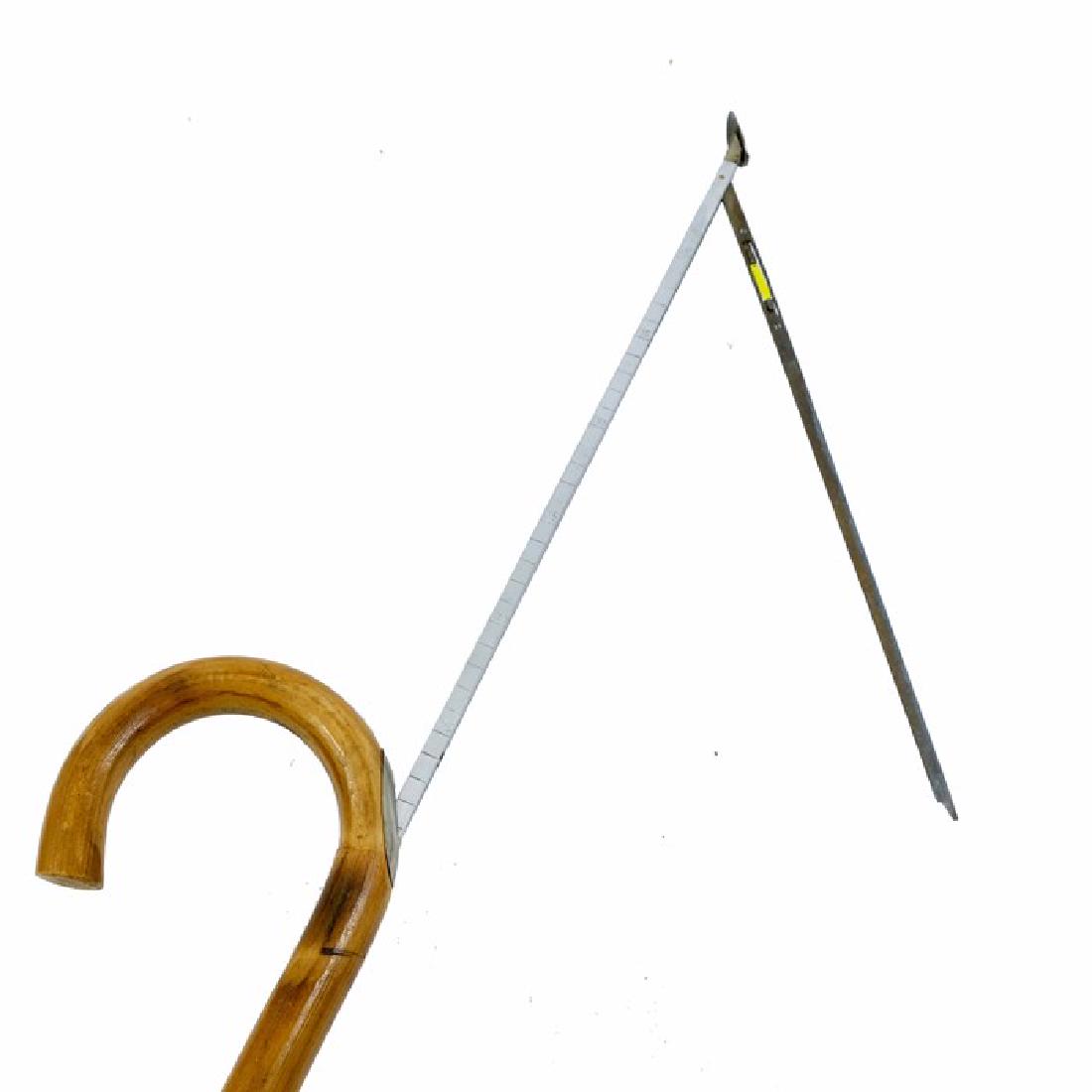 A horse measuring bamboo walking cane, 20th century,: A horse measuring bamboo walking cane, 20th century, fitted with a hidden extendable measuring stick with hinged spirit level, 99cm high