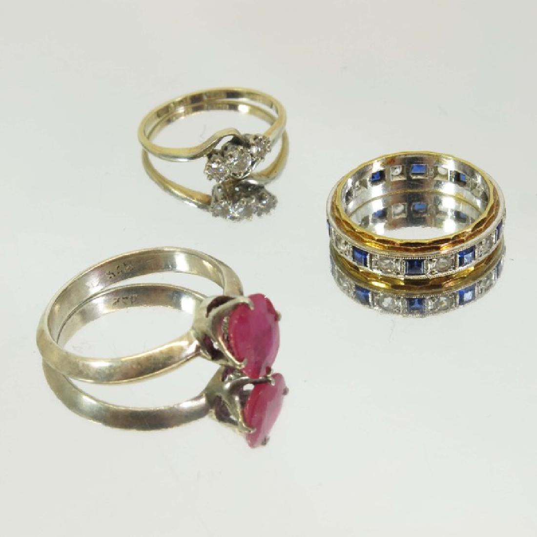 A three stone diamond ring, together with a sapphire (1 of 4)