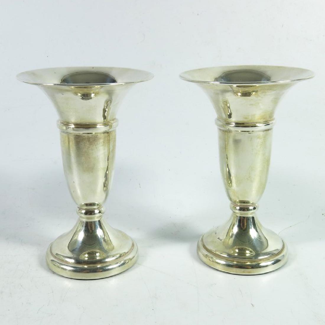 A pair of Elizabeth II silver dwarf trumpet vases, W I: A pair of Elizabeth II silver dwarf trumpet vases, W I Broadway and Co., Birmingham 1978/79, weighted, 9.5cm high (2)