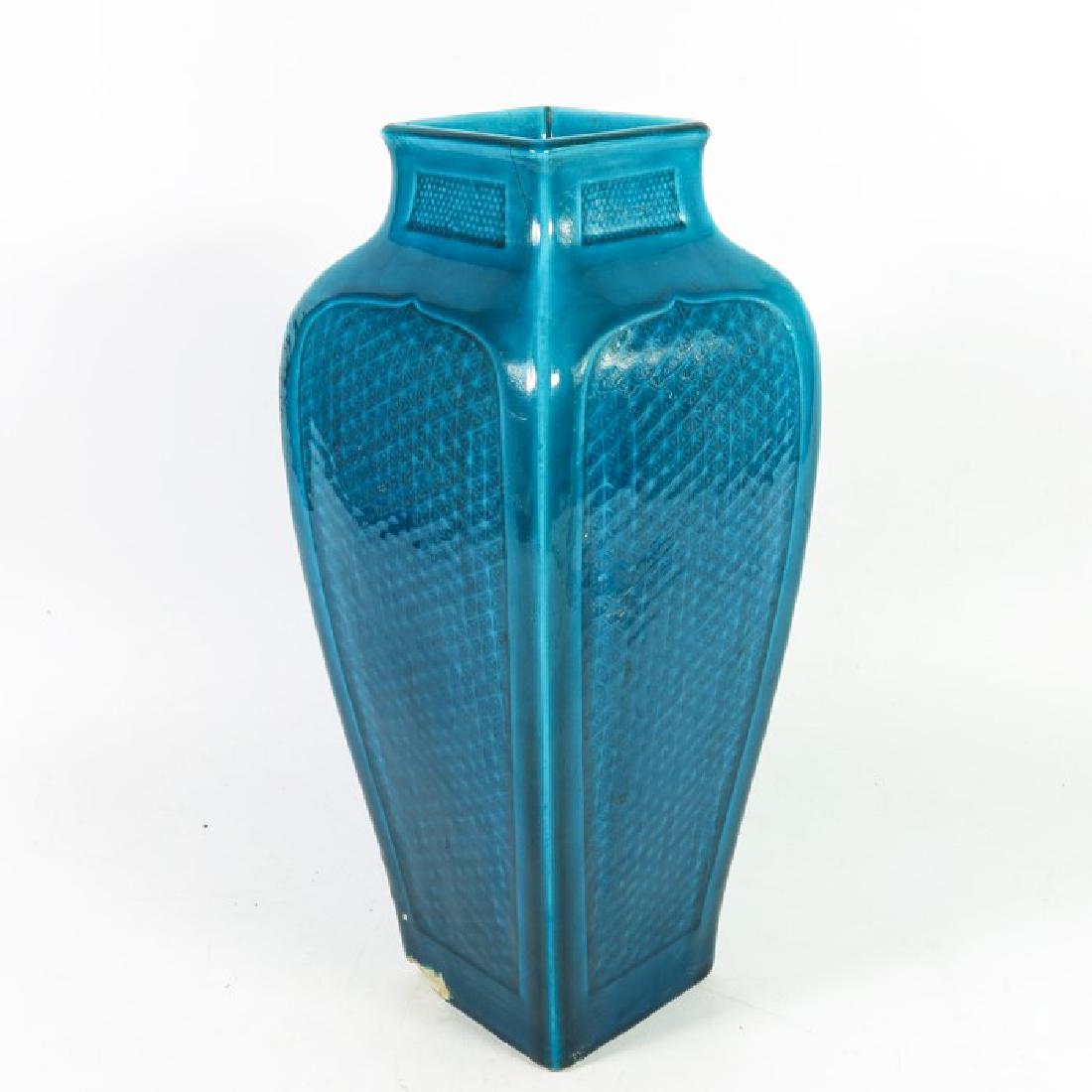 Theodore Deck, a Persian Blue faience vase, circa 1875,: Theodore Deck, a Persian Blue faience vase, circa 1875, square section shouldered form in the Japonesque style, the arcaded sides with underglaze moulded geometric ground, signed, 30.5cm high