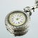 A Victorian silver fob watch on chain, chased, the dial