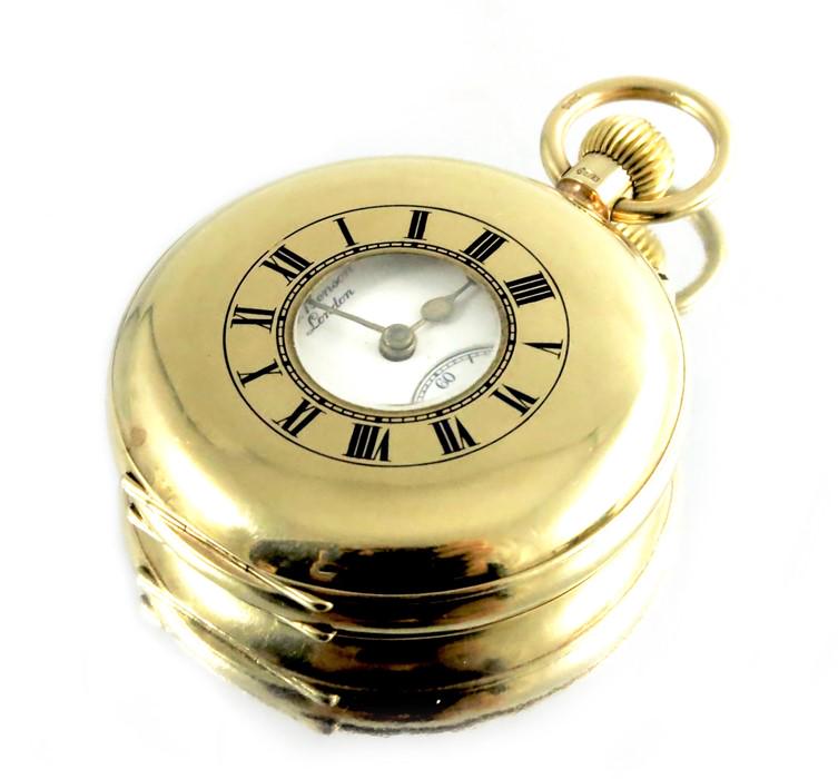 A 9 carat gold half hunter pocket watch, J W Benson,: A 9 carat gold half hunter pocket watch, J W Benson, London 1931, blue enamelled Roman numerals to the case, 5cm diameter