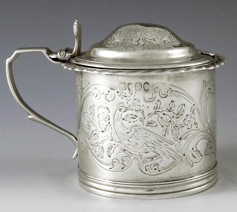 John and Henry Lias, London 1839, a Victorian silver: John and Henry Lias, London 1839, a Victorian silver mustard pot, cylindrical form, etched with foliate scroll and bird design, below gadrooned brim, double ogee domed lid, angled handle, glass liner,