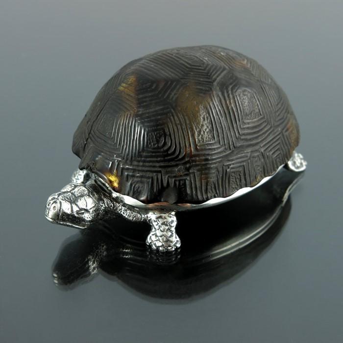 A Victorian novelty silver and tortoiseshell table: A Victorian novelty silver and tortoiseshell table vesta case, Thomas Johnson II, London 1880, realistically modelled as a tortoise, the hinged and moulded shell lid opening to reveal a gilded interio