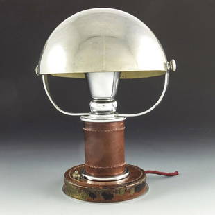 Paul Dupre Lafon for Hermes, an Art Deco leather and: Paul Dupre Lafon for Hermes, an Art Deco leather and chrome table lamp, the rotating hemispherical shade supported on two arms, on a cylindrical leather bound and stitched column and flat cylinder bas