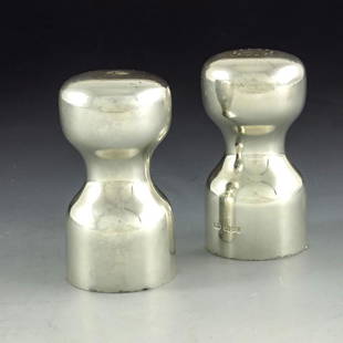 Robert Welch, a pair of Modernist silver salt and: Robert Welch, a pair of Modernist silver salt and pepper shakers, London 1985, waisted hourglass form, with bayonet fittings to the underside, 8.5cm high, 7.09ozt