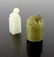 Two Chinese carved jade seals, both with lions to the