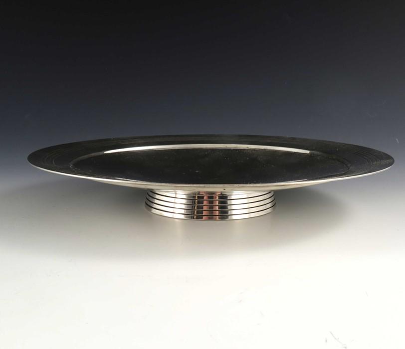 Keith Murray for Mappin and Webb, an Art Deco silver: Keith Murray for Mappin and Webb, an Art Deco silver plated comport, circa 1933, shallow dished circular for, with stepped rim and incised concentric ring decoration, on conical incised ring foot, sta
