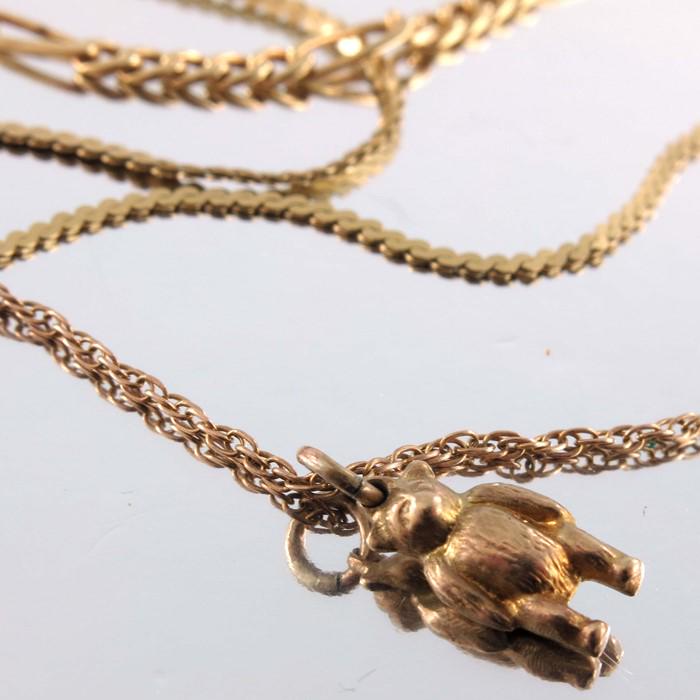 Three 9ct gold chains, one with bear charm pendant, (1 of 2)