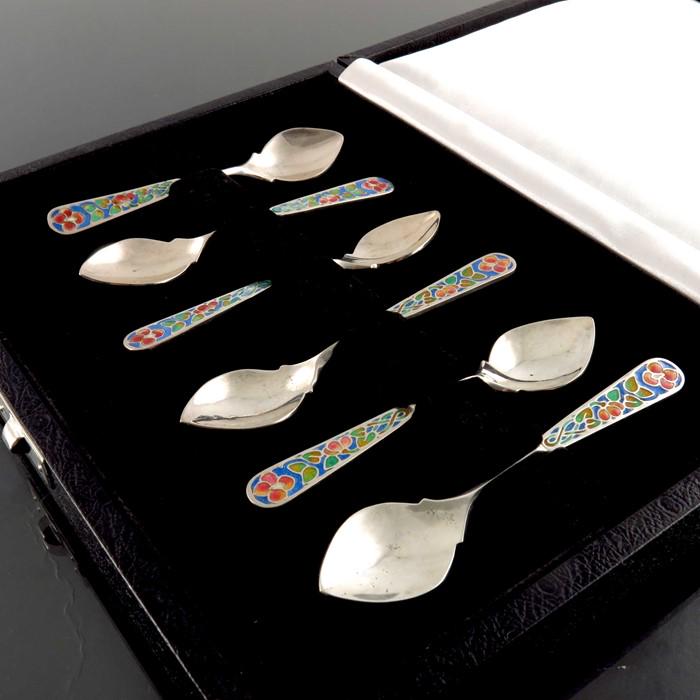Bernard Instone, a matched set of six Arts and Crafts: Bernard Instone, a matched set of six Arts and Crafts style silver and enamelled coffee spoons, Birmingham 1924 and 1957, step shouldered and pointed bowls, planished to the back, the terminals with c