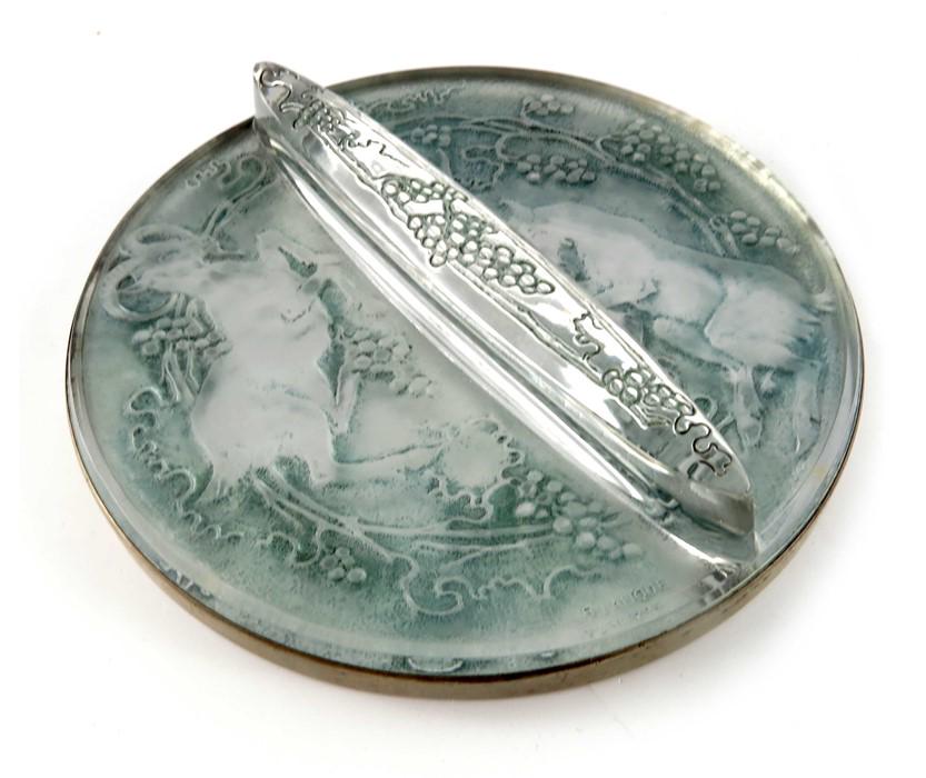 Rene Lalique, a Deux Chevres glass hand mirror, model: Rene Lalique, a Deux Chevres glass hand mirror, model 678, designed circa 1919, frosted and green stained, moulded mark R Lalique, 16cm diameter