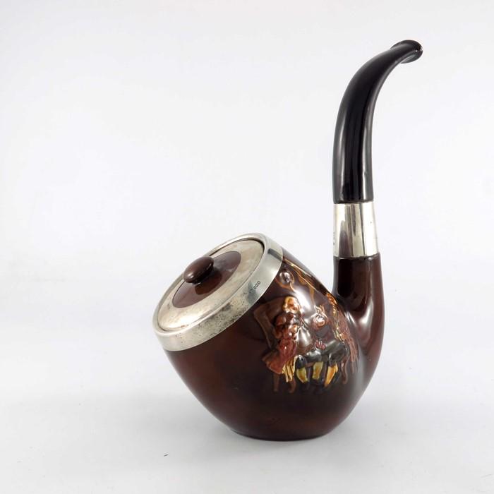 A Royal Doulton silver mounted Kingsware tobacco jar: A Royal Doulton silver mounted Kingsware tobacco jar and cover, modelled as a pipe, relief decorated with smoking gentlemen, with silver rim and lid marks George Betjemann & Sons, London 1915, 31cm hi