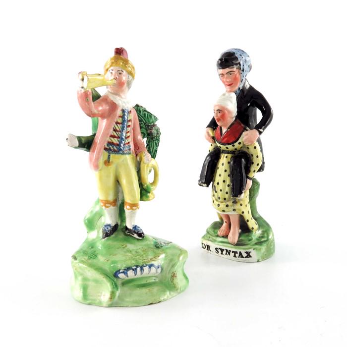 A Walton Staffordshire pearlware figure of a trumpet: A Walton Staffordshire pearlware figure of a trumpet player and another figure of Dr Syntax, circa 1820s, 15.5cm high